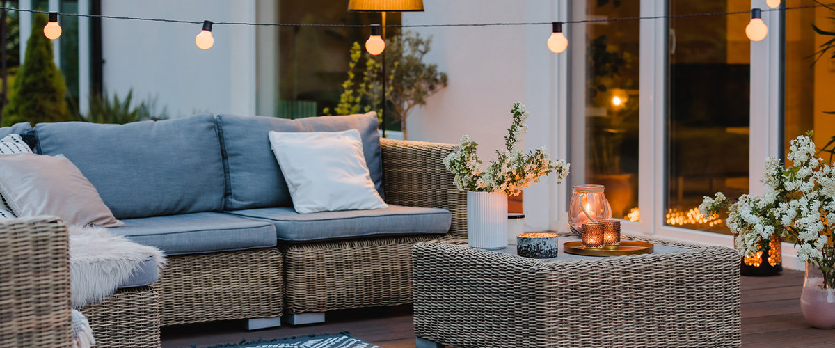 Outdoor living space with string lights.